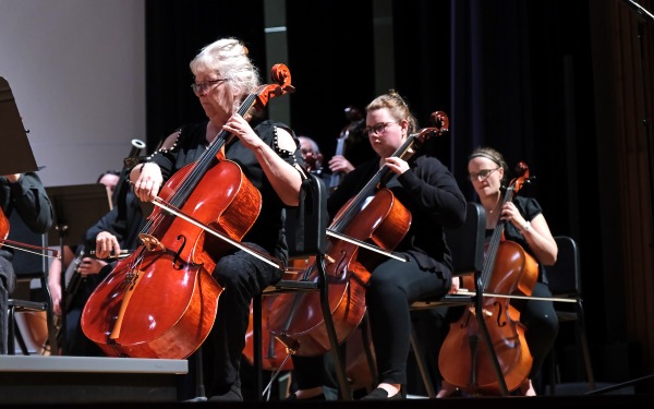 Female cello players in the community orchestra