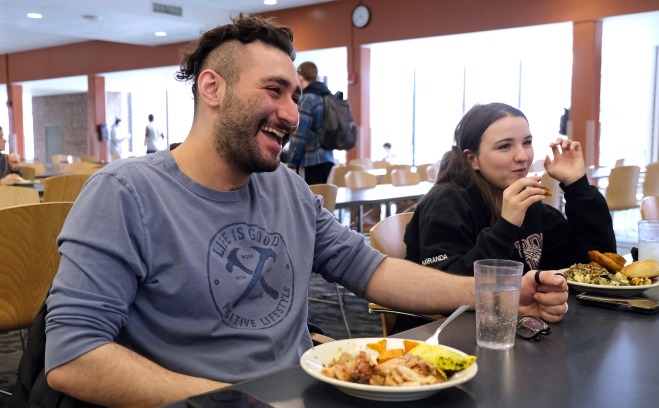 Smiling students in Holmes Dining Commons