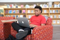 Student on computer in campus library