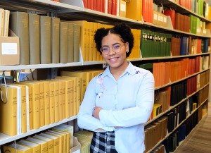 Lorenny Arias Diroche tell us your story in library stacks