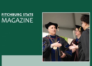 President presenting our digital magazine at podium