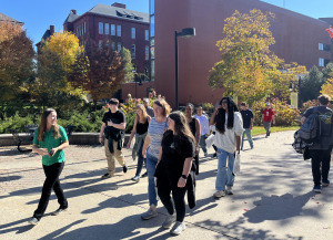 Tour at open house with Hammond in background from across the street