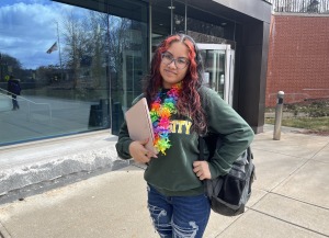 Adrianna Social Media Ambassador standing in front of Hammond with laptop