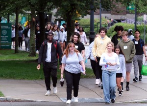 Large group at orientation walking to Weston