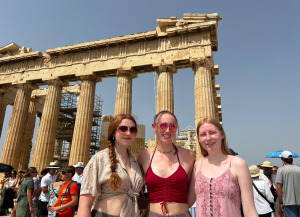Cassie Israelson, Skye Goba, and Annie Hart pose in front of the Parthenon on the Acropolis in Athens, Greece in Summer 2024.