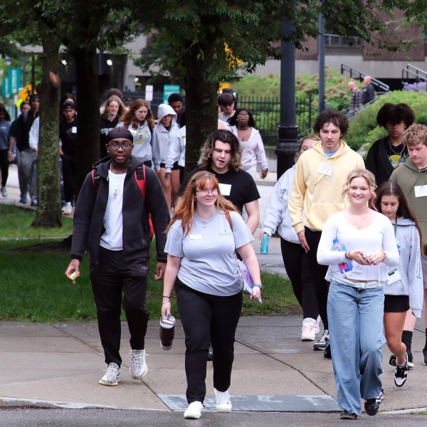 Large group at orientation walking to Weston
