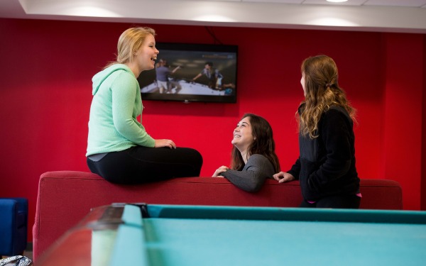 Students sitting in the dorm's lounge