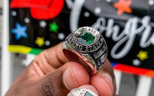 Graduate with class ring