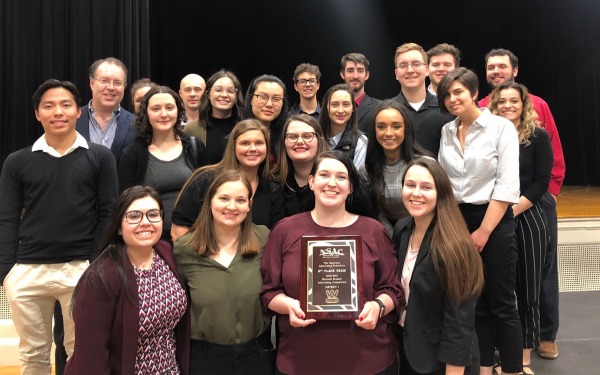 Group photo of communication students with advertising award