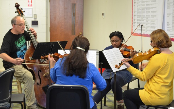 Students playing instruments together at Chamber Music Fest