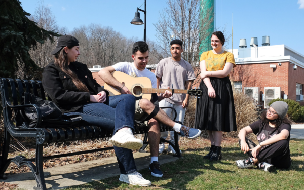 Students with guitar by Edgerly on Quad