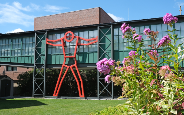 Fitchburg Art Museum outside building with big red man and flowers