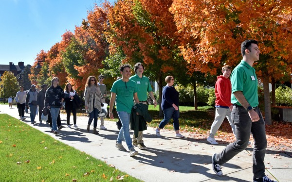 Fall open house tour on the quad with fall foliage in trees
