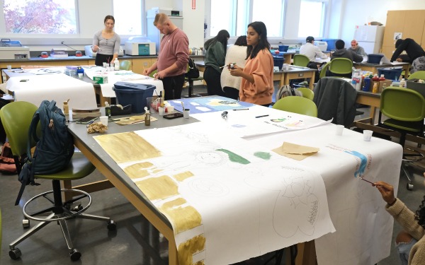 students working on posters in a classroom