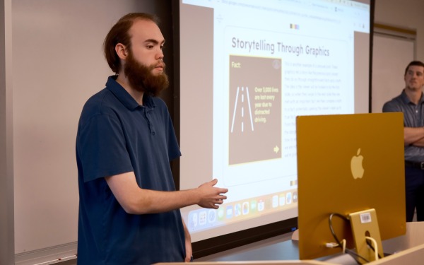 Male student presenting in life saving DMI class