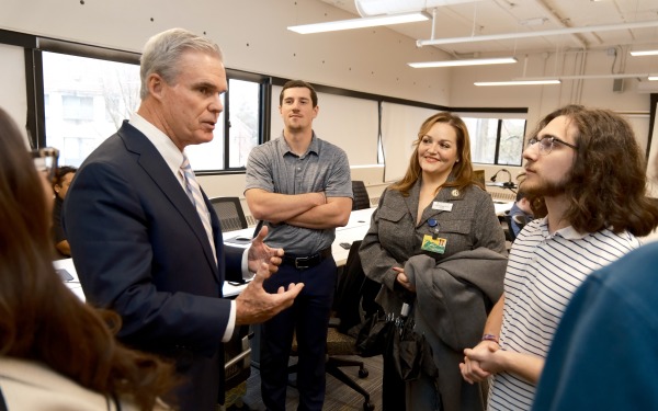 Attorney General Joseph Earley and President Hodge talking to students in DMI class