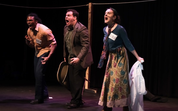 Absurdist Alert students on stage yelling and angry
