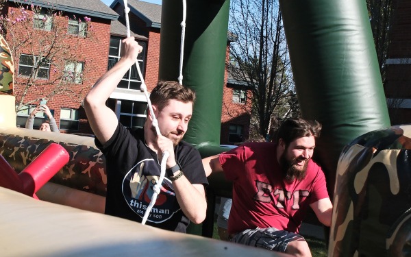 Students in blow up obstacle course