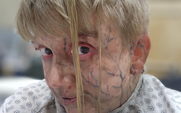 Traci Bartlett with face makeup on set for American Horror Story.