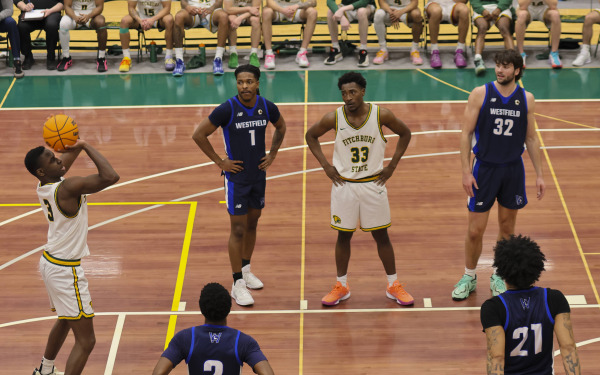 Fitchburg State basketball game with player taking a free throw.