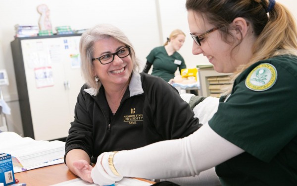 Nursing student with faculty