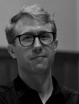 Black and white headshot of Jonathan Harvey