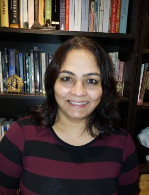 Aruna Krishnamurthy headshot in her office