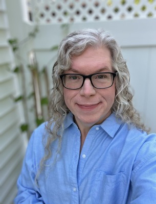 Francis Mabee outside by fence.