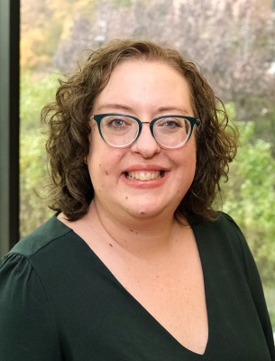 Susan Beddes CSA inside near a window