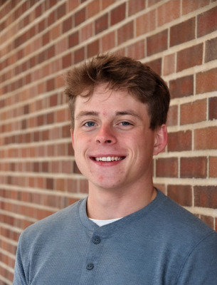 Portrait of Ryan Burns outside.