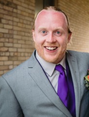 Andrew Pottorff in suit at wedding UBMS