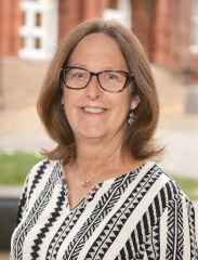 Portrait of Ms. Pamela Mayou SGOCE outside.
