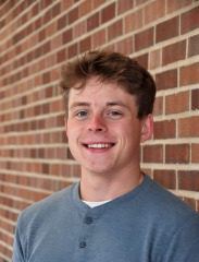 Portrait of Ryan Burns outside.