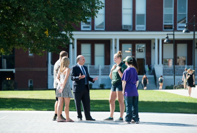 President Lapidus speaks with students on the quad 