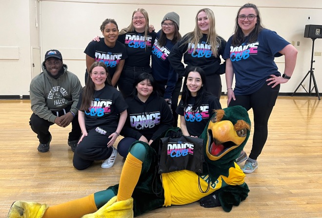 Group photo of dance team with Freddy in dance studio