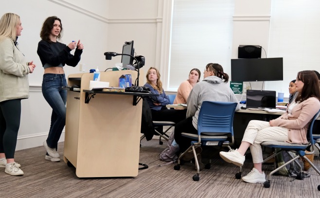 Students give presentation on what they learned in the Cormier archives