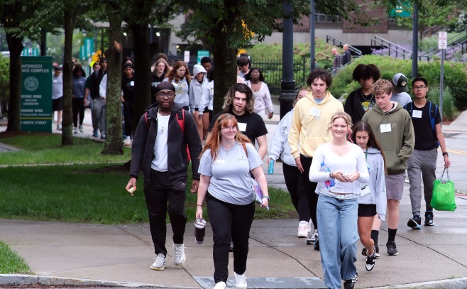 Large group at orientation walking to Weston