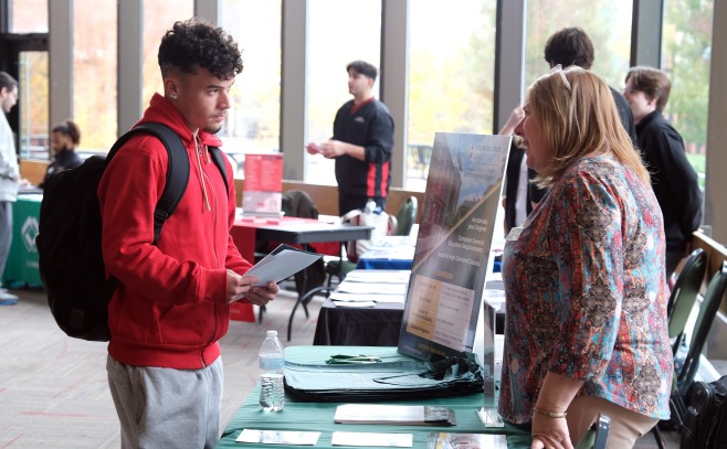 SGOCE and student at the Graduate Fair in Hammond Hall Main Lounge