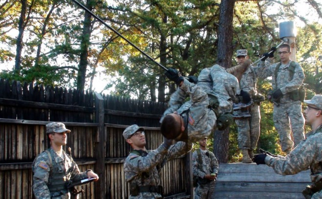 ROTC students doing a rope climbing exercise