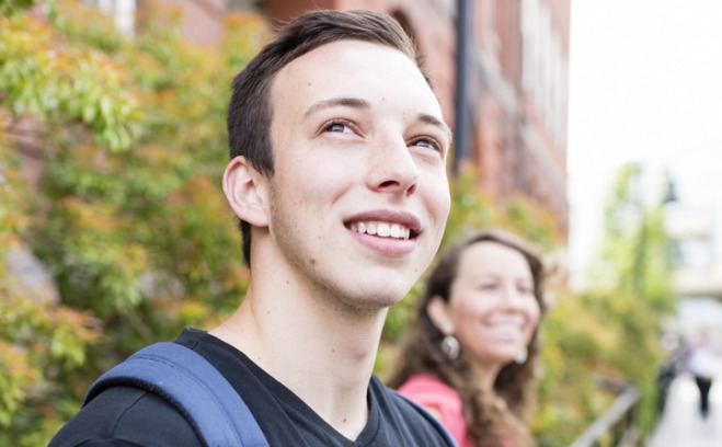 Smiling Student Looks Up At Quad