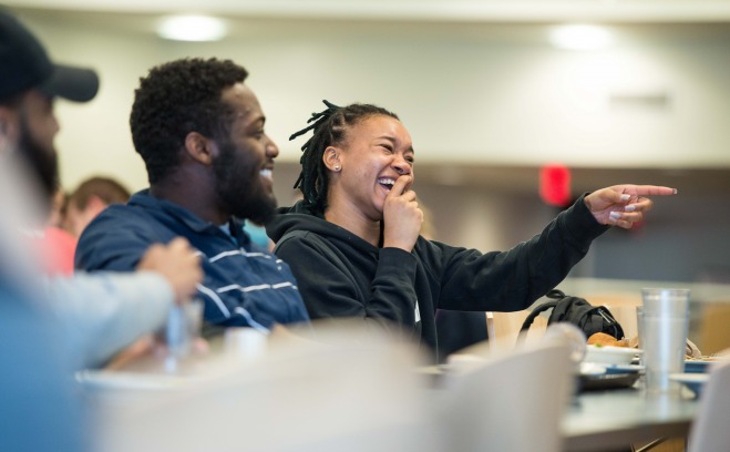 Students laughing in Holmes Dining