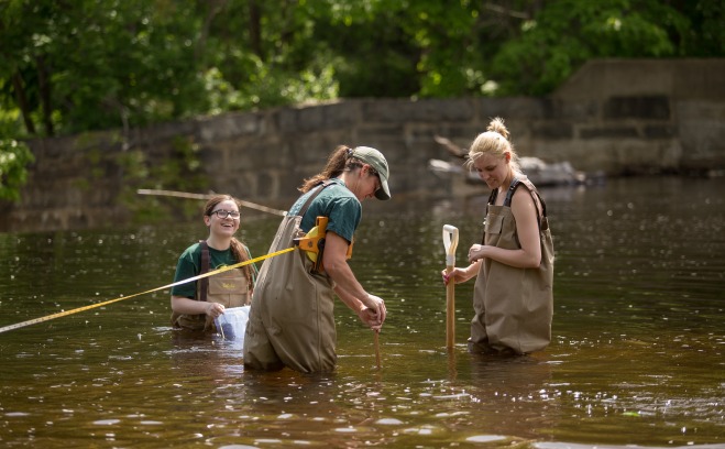 environmental bio students in river