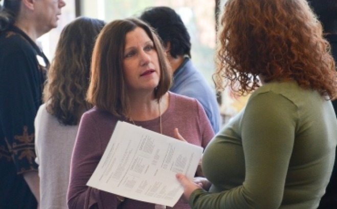 A photo of colleagues in conversation 