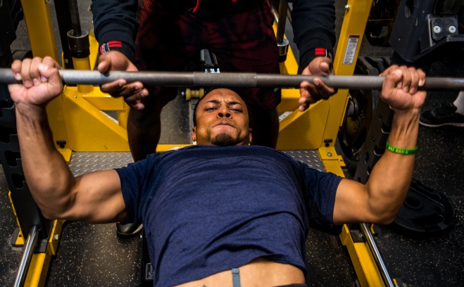 student lifting weights