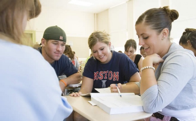 Students analyze text in a group discussion 
