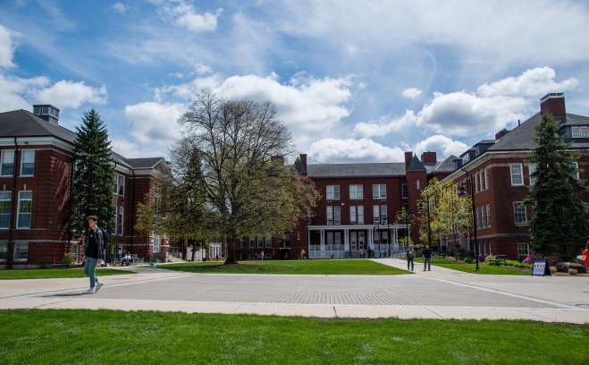 Students walking across quad on a sunny afternoon