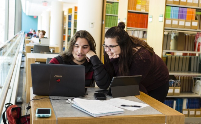 Students with laptop in Library