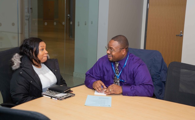 student and advisor at a table
