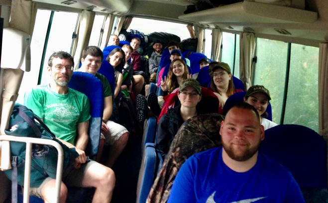 Falcons traveling in a bus while visiting another country 
