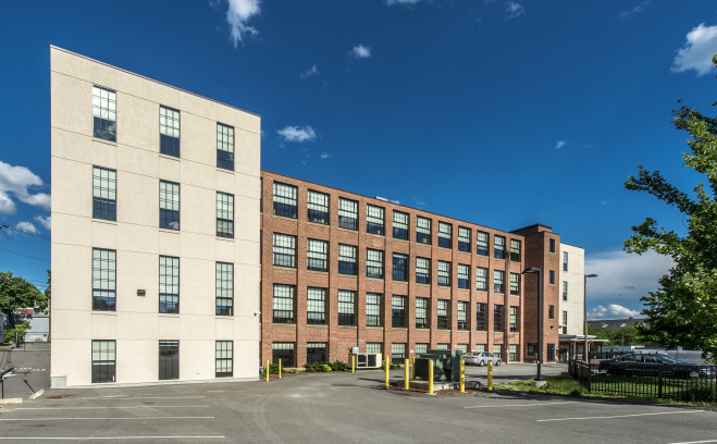 Simonds Hall exterior with parking lot.